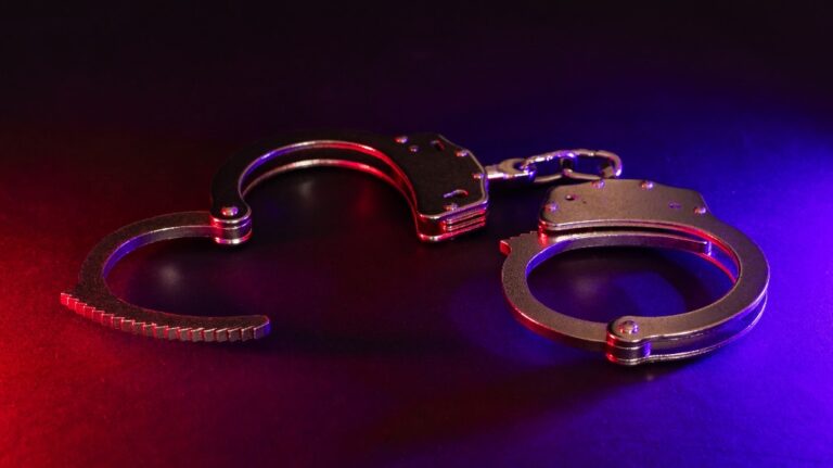 handcuffs and red and white lights