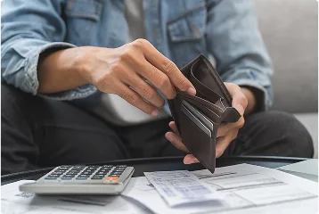 a person holding a wallet