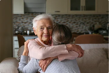 a woman hugging an older woman