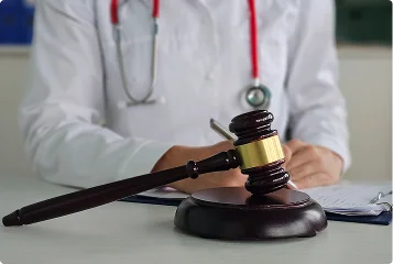 a doctor writing on a document