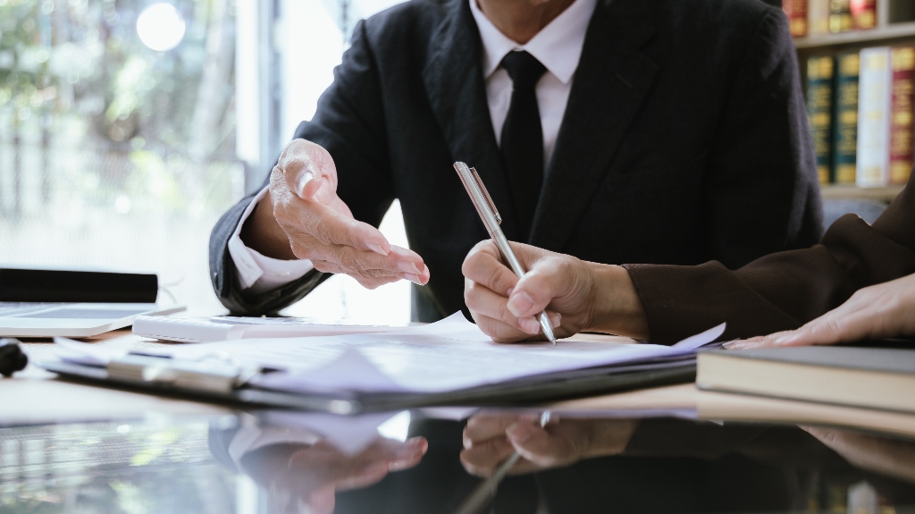 Client signing forms with lawyer