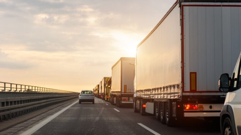 semi truck next to a car