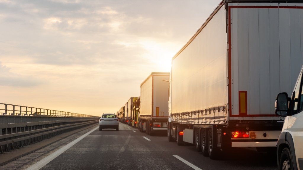 semi truck next to a car